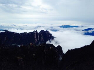 China Mount HuangShan - April, 2015: Natural scenery, sunsets, peculiarly-shaped granite peaks, Huangshan pine trees and views of the clouds from above. Photo taken in Yellow Mountain (UNESCO).