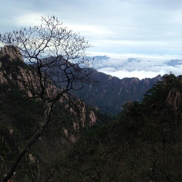 China Mount HuangShan - April, 2015: Natural scenery, sunsets, peculiarly-shaped granite peaks, Huangshan pine trees and views of the clouds from above. Photo taken in Yellow Mountain (UNESCO). © Morying