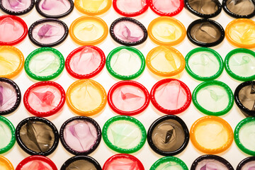 Colorful condoms background.