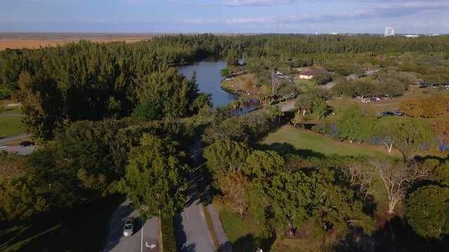 Aerial drone view over cars and roads in Markham park, Weston, Florida, USA