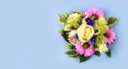 Pink and white roses on a light blue background. Festive flower arrangement. Background for greeting cards, greetings, invitations. © Olirina