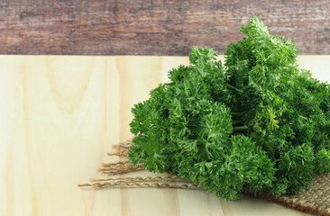 Fresh green parsley on wooden background