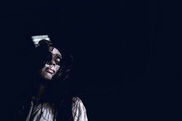 Portrait of asian woman make up ghost face,Horror scene,Scary background,Halloween poster