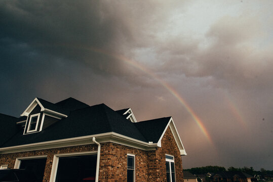 Double rainbow over house.