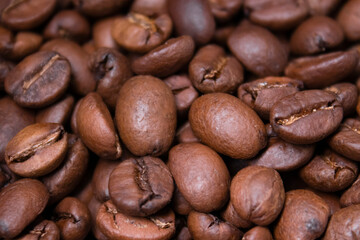 close up of Freshly roasted coffee beans background. top view