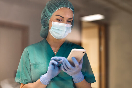 Portrait of Female Doctor Using Phone