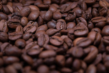 close up of Freshly roasted coffee beans background. top view