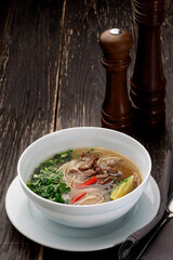 Vietnamese soup Pho bo in a white bowl