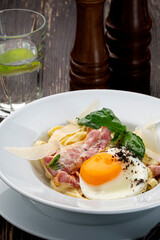 Pasta Carbonara on wooden background