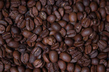 close up of Freshly roasted coffee beans background. top view
