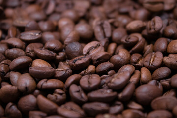 close up of Freshly roasted coffee beans background. top view
