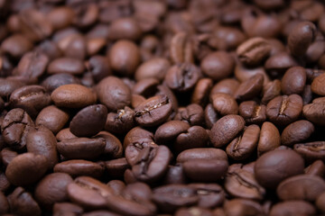 close up of Freshly roasted coffee beans background. top view