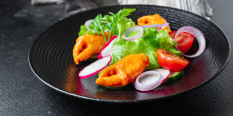 salad seafood vegetable crab claws, surimi crab sticks tomato, cucumber, lettuce on the table meal snack copy space food background rustic 