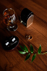Groom Details: whiskey, rings, cufflinks, perfume