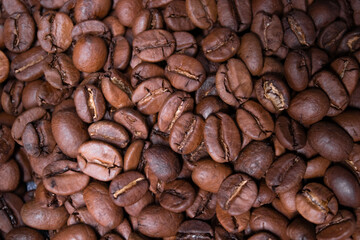 close up of Freshly roasted coffee beans background. top view
