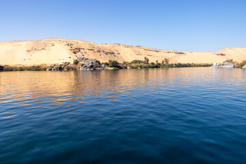 Fototapeta na wymiar tropical island with trees in Nile river ,Aswan, Egypt