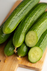 Fresh cucumbers on a cutting board.Photo with bokeh effect.Proper nutrition.
