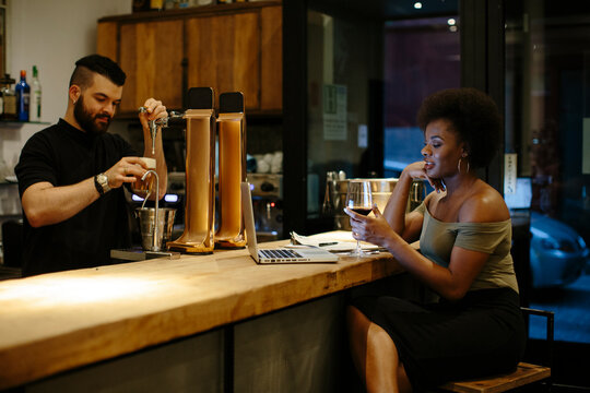 Restaurant staff drinking at the bar counter.