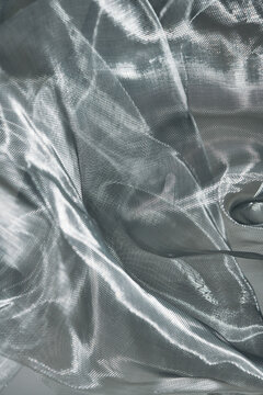 Wrinkled shiny material of silver mesh