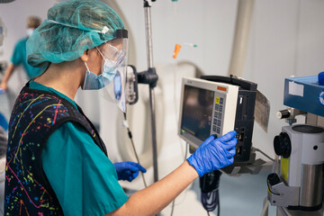 Female Doctor Using Medical Equipment