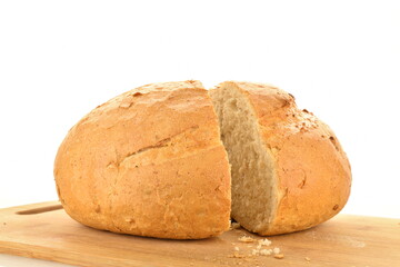 Two halves of delicious white bread on a wooden tray, close-up, isolated on white.