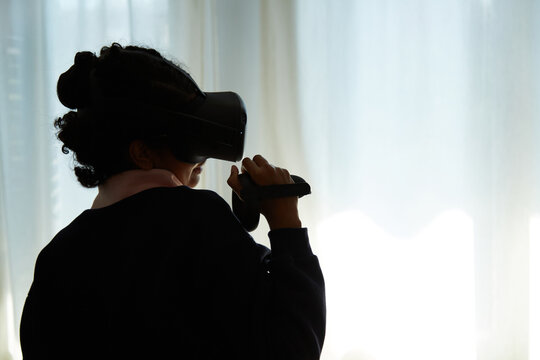 Unrecognisable person playing in VR
