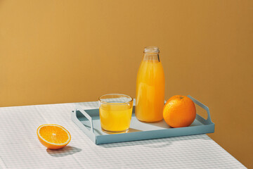 Orange juice on a table and fruit