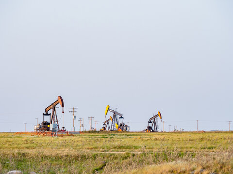 oil field pump in sunset