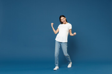 Full length young happy excited satisfied overjoyed latin woman 20s in white casual basic t-shirt...
