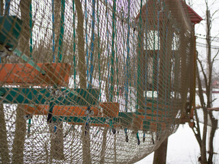 rope town. steps between trees with safety net