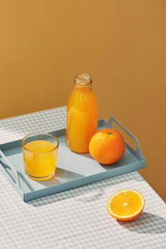 Glasses of fresh orange juice with sliced orange
