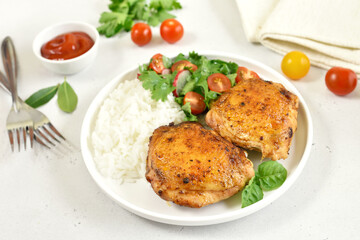 Fried chicken thighs with vegetables