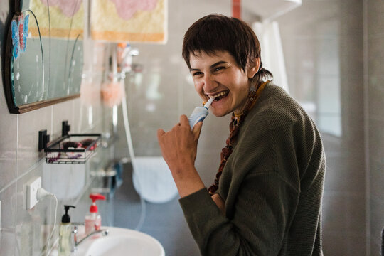 Woman with disability brushing teeth
