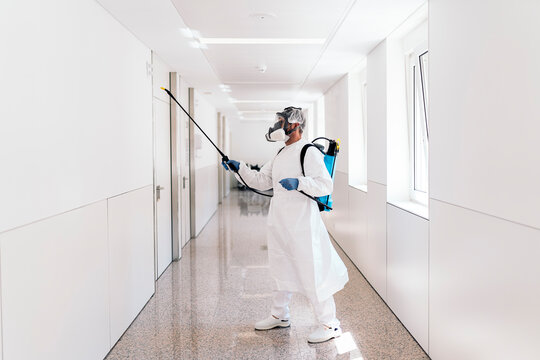 Worker Disinfecting Hospital - Powered by Adobe
