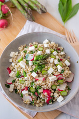 healthy spring salad with asparagus, barley and cheese