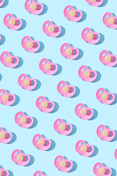 Orthodontic baby pacifiers pattern with shadows.