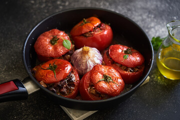 baked stuffed tomatoes on a pan