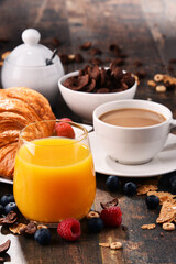 Breakfast served with coffee, juice, croissants and fruits