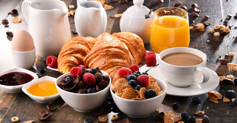 Breakfast served with coffee, juice, croissants and fruits