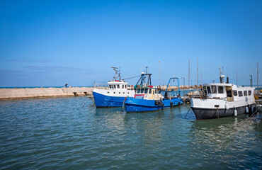 Fototapeta na wymiar Fishing boats at old Jaffa marina, Israel.