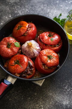 baked stuffed tomatoes on a pan