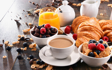 Breakfast served with coffee, juice, croissants and fruits