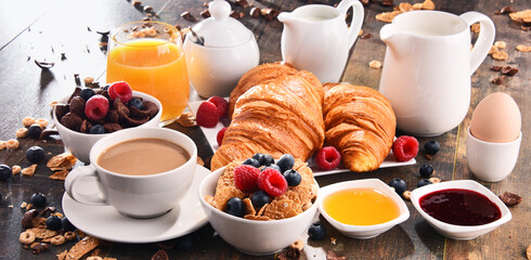 Breakfast served with coffee, juice, croissants and fruits