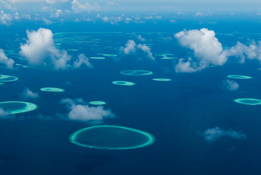 Clouds and atolls, Maldives.