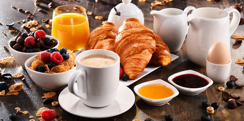 Breakfast served with coffee, juice, croissants and fruits