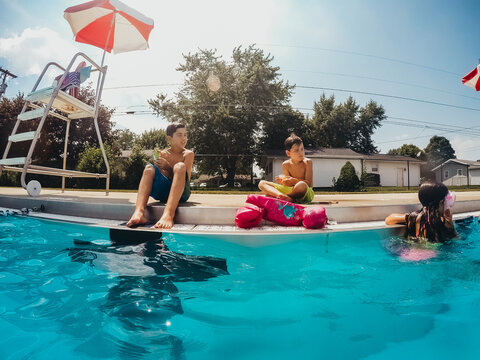 Kids Eating Snack At Pool.