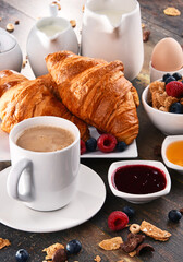 Breakfast served with coffee, juice, croissants and fruits