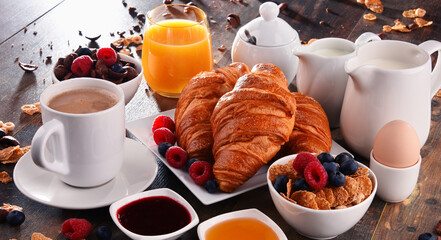 Breakfast served with coffee, juice, croissants and fruits