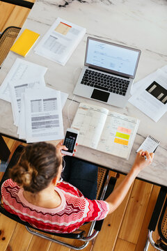 Unrecognizable accountant working at home