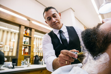 Man in barbershop having styling procedures